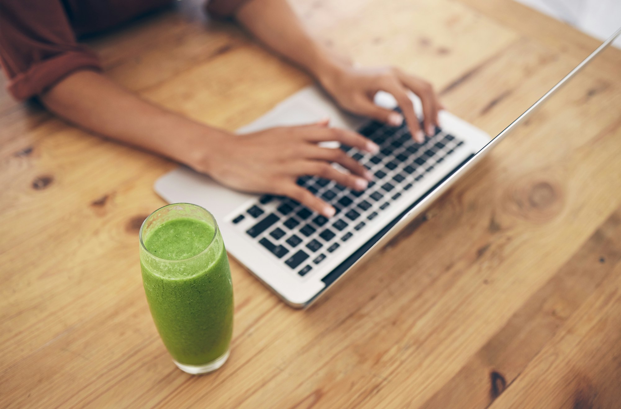 Hands, laptop and nutritionist blog by woman typing, post or review on healthy living at home. Soci